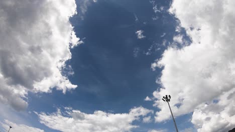 aerials view cloudscape nature background in sunny summer day. cloudy blue sky in clear weather. sunlight power solar energy atmosphere, fluffy white clouds stormy cotton cloud in wide angle view.