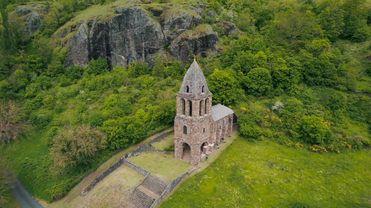 aerial shot around Sainte Marie des Chazes Chapel on a sunny day in Haute Loire departement, Auvergne Rhone Alpes Region, France