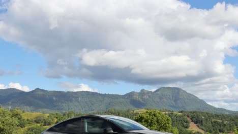 car travels across a picturesque mountainous area