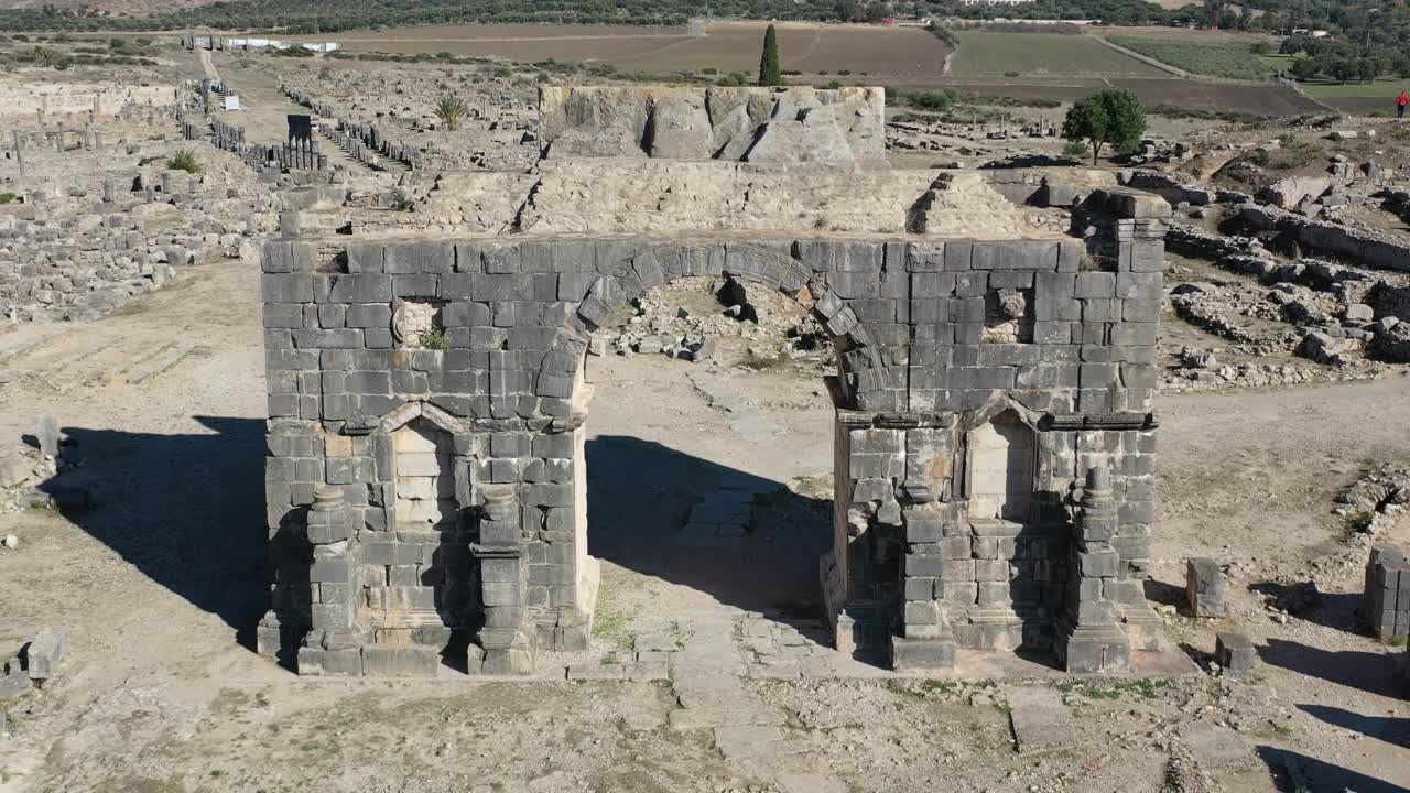 Volubilis, a Roman-era city in Morocco, was a key administrative and trade hub, famous for its monumental ruins, detailed mosaics, and rich historical legacy
