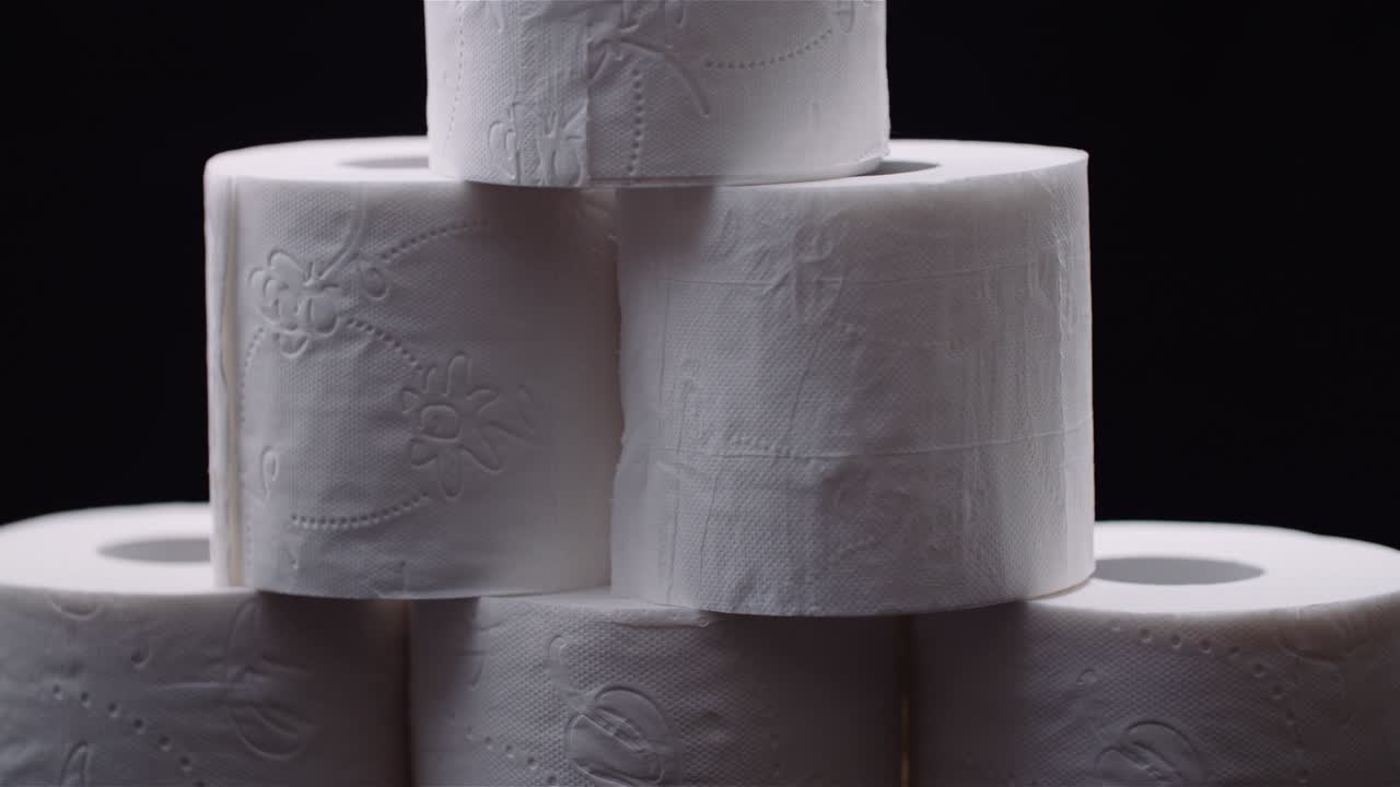 Toilet Paper Isolated on Black Background Rotating.