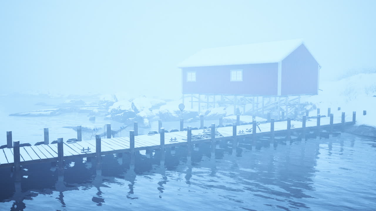 눈으로 인 도크에 있는 빨간색 오두막