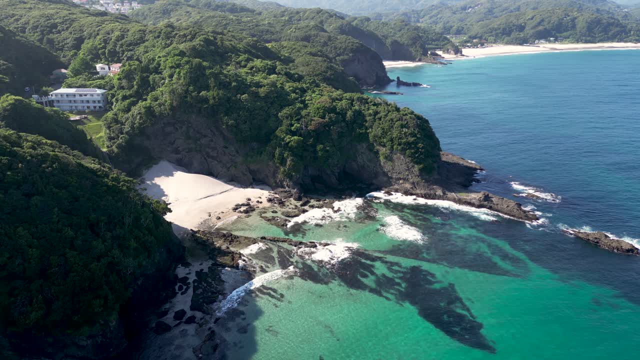 Drone view over stunning house next to secluded hidden beach