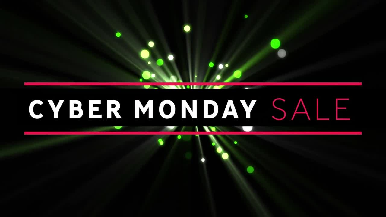 Digital animation of cyber monday sale text banner against green spots of light on black background