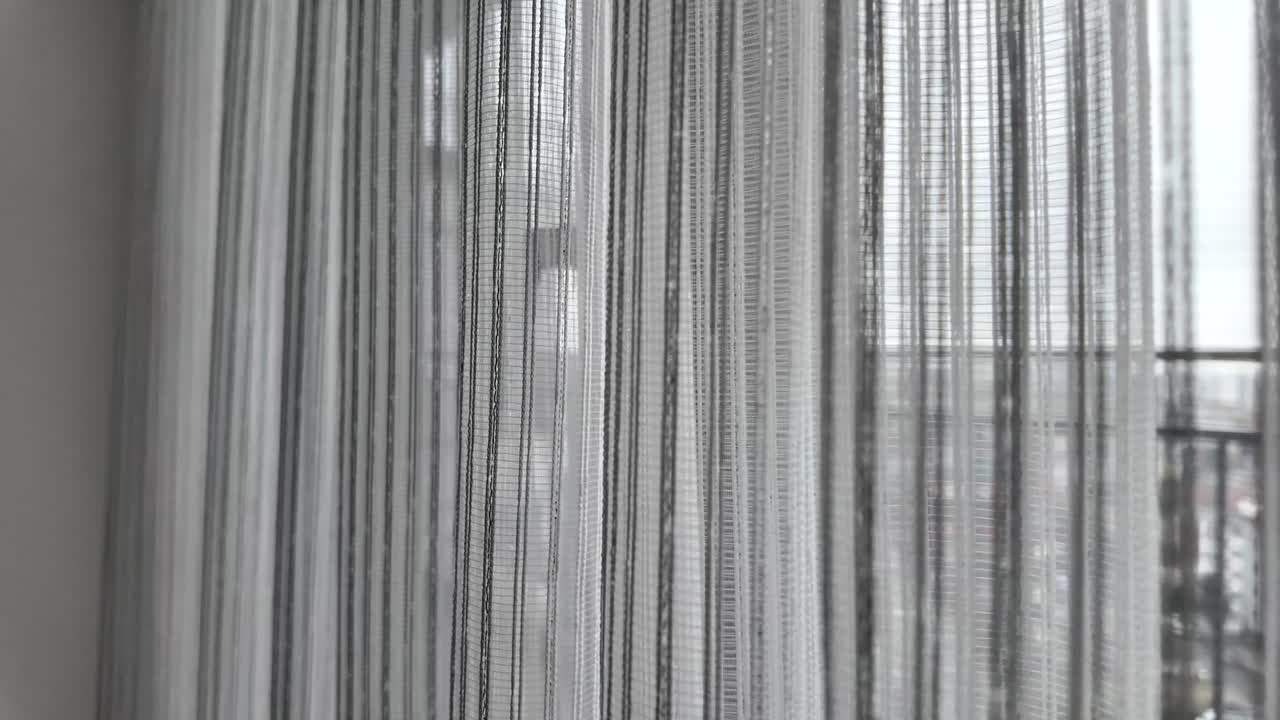 Curtains hanging in front of a window