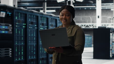 data center engineer using laptop to develop disaster recovery plans