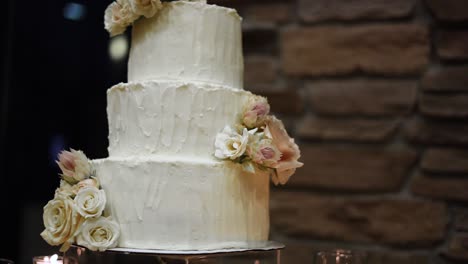 beautiful detailed wedding cake with three tiers and floral design