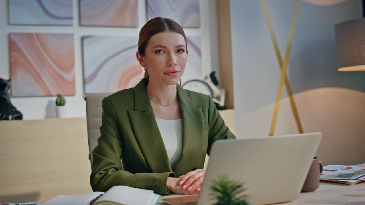 Confident ceo sitting office desk with laptop thinking about career closeup