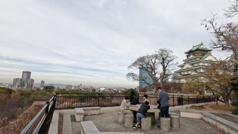 people enjoying a city view from a high vantage point