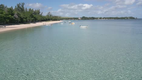 mauritius - albion - slow forward flying over the lagoon to the boats