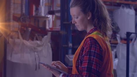 Animation-of-light-spots-over-caucasian-female-worker-with-tablet-in-warehouse