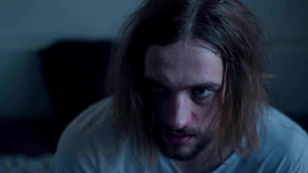 A Man Wakes Up Sweating From a Nightmare - Close Up