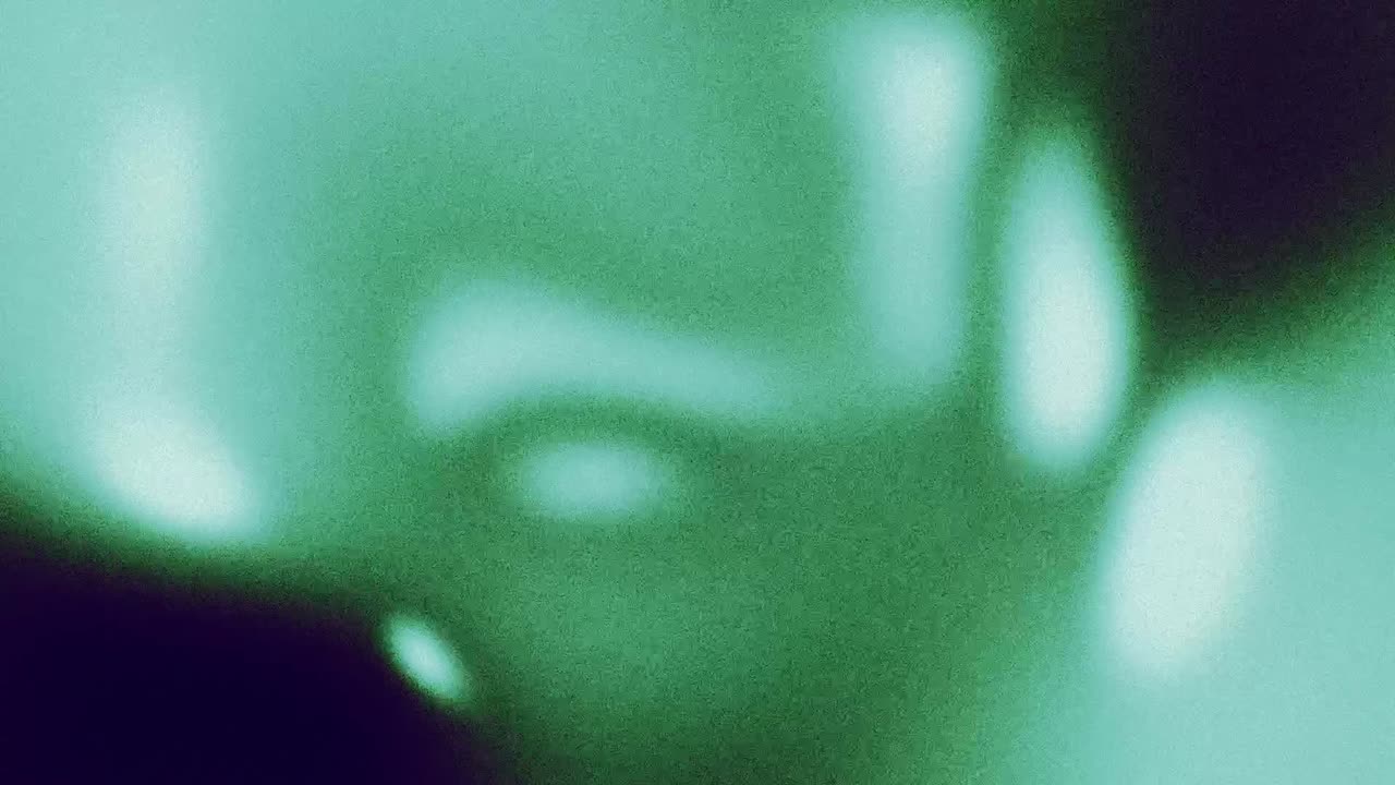 Dynamic Grainy Green Abstract Background with Moving Light