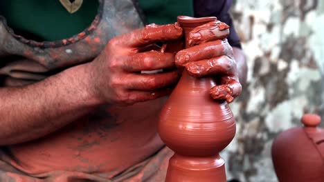 medieval potter using potters wheel and hands crafting earthenworks clay molds porcelains ceramics producing cooking pots, storage containers decorative objects guild member medieval craft ocupation