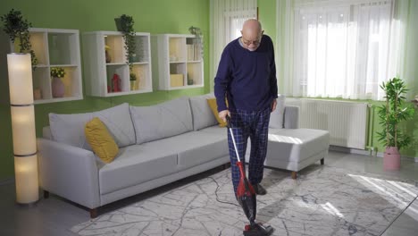 Old-tired-and-exhausted-man-cleaning-at-home.-Retirement-concept.