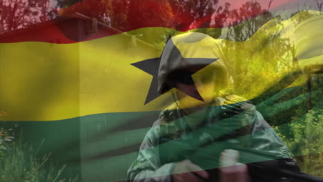 animación de la bandera de ghana sobre un soldado caucásico con un rifle