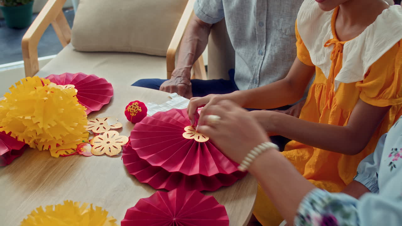 Asian Family Crafting Paper Garland for Lunar New Year