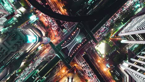 time-lapse or hyper-lapse aerial view highway road junction or intersection traffic at night for transportation concept.