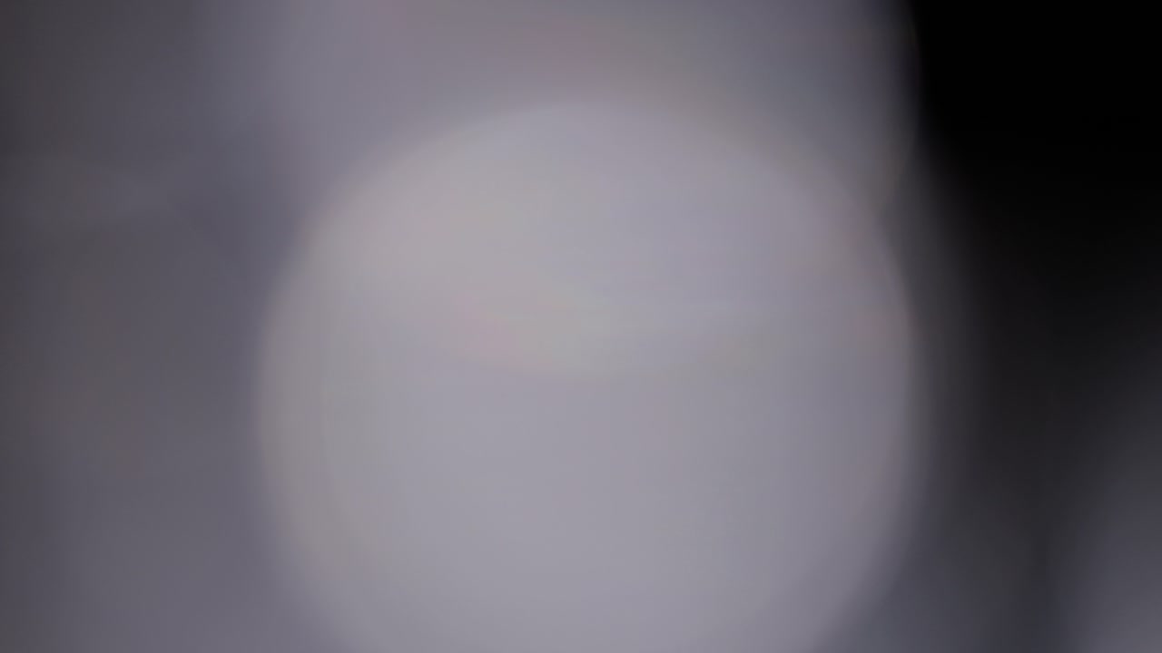 Multicolored light leaks 4k footage on black background, lens studio flare leak burst overlays