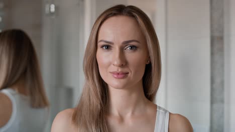 close up portrait of young caucasian woman in the bathroom.