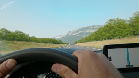 driving on a highway with a mountain view