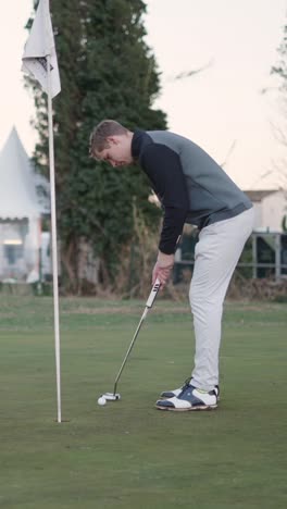 golfer putting on green