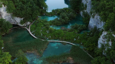 aerial view of wooded trails along the lakeshores of plitvice lakes national park in central croatia