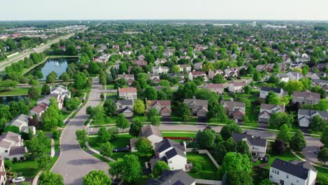 high end houses plainfield illinois usa aerial over residential houses community at sunset - rush hour in the summer 2023