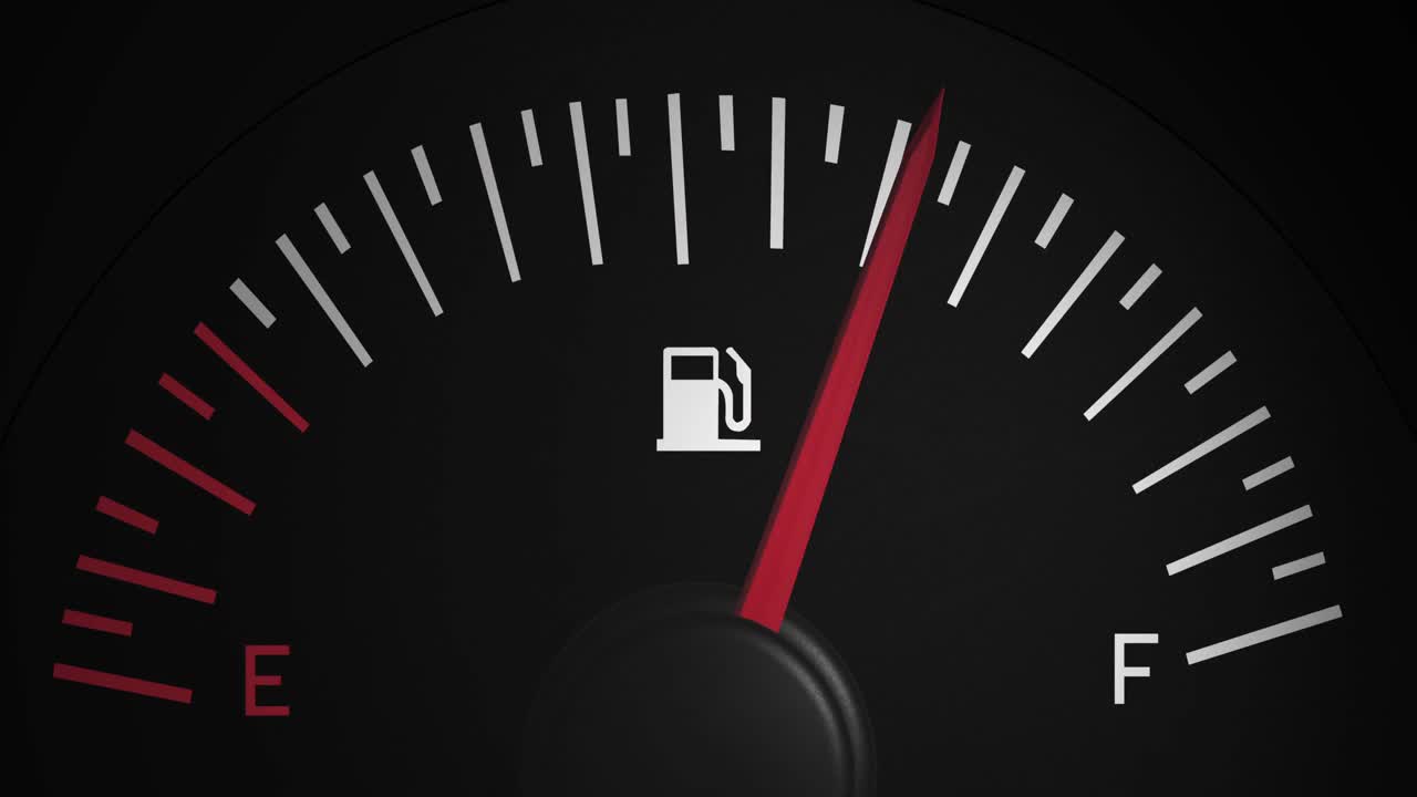 검은 바탕 위에 움직이는 연료 측정기의 애니메이션