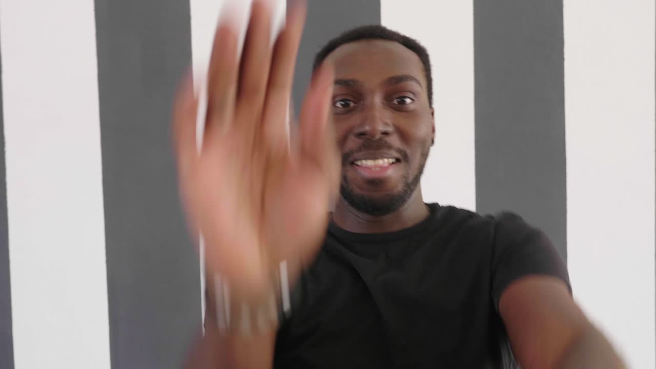 Man Smiling and Pointing