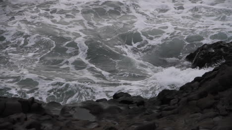 Waves-Splash-against-Rocks-on-Icelandic-Black-Sand-Beach