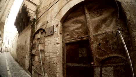 old gates and doors closed with laying from bricks narrow ancient street in urfa