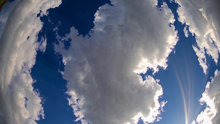 Time Lapse of White Clouds Moving Across a Deep Blue Sky