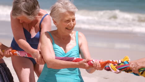 a group of mature friends are shooting a rope