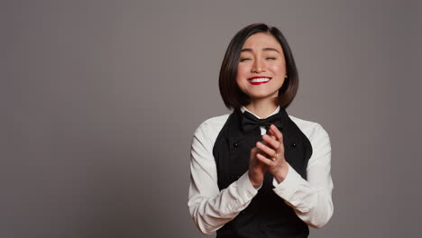 Restaurant-hostess-clapping-hands-and-celebrating-for-someone,