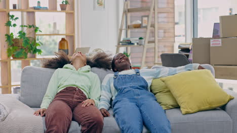 lesbian, couple and relax on sofa in new home