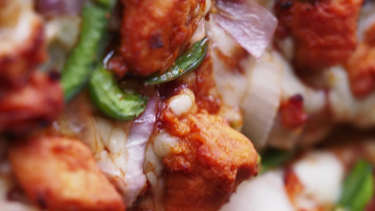 Close-up of a Chicken Tikka Pizza