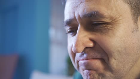 portrait of respectful and understanding man smiling sadly.