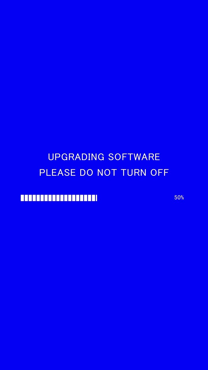 Video verticale di una barra di avanzamento del caricamento con testo sullo schermo "aggiornamento software, non spegnere" su sfondo blu.