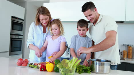 smiling family preparing a healthy dinner together