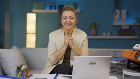 Home-office-worker-woman-looking-at-camera-with-excitement-and-feeling-happy.