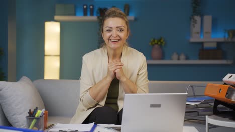 home office worker woman looking at camera with excitement and feeling happy.