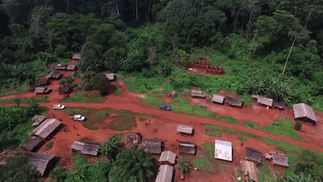 aerial view around a poor village in the jungles of cameroon, africa - orbit, drone shot