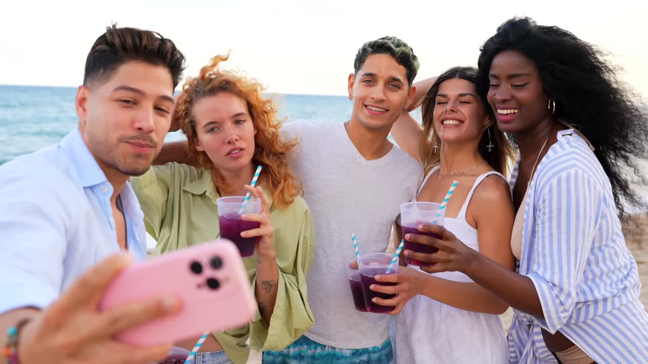Friends Having Fun on the Beach with Drinks