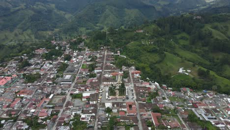 wide aerial view of small colombian community in the coffee region, tropical mountain landscape in salento.