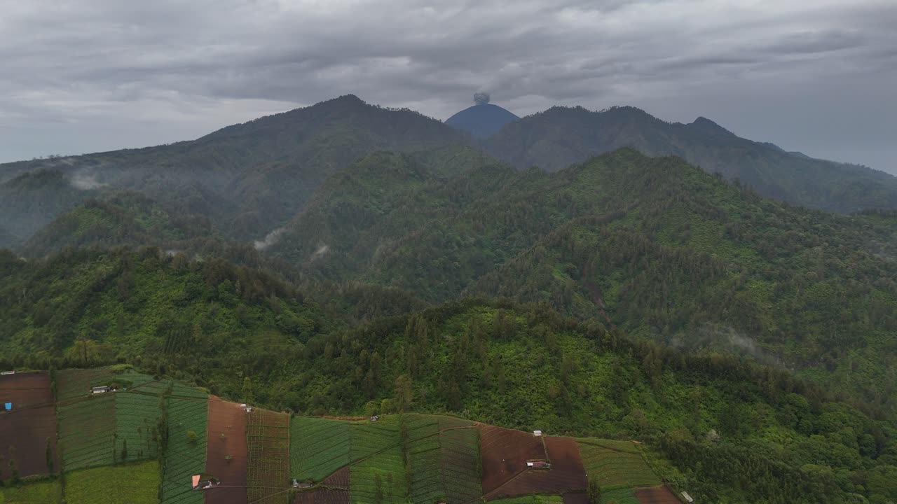 Aerial drone view of an active volcano erupting ash cloud in east java indonesia