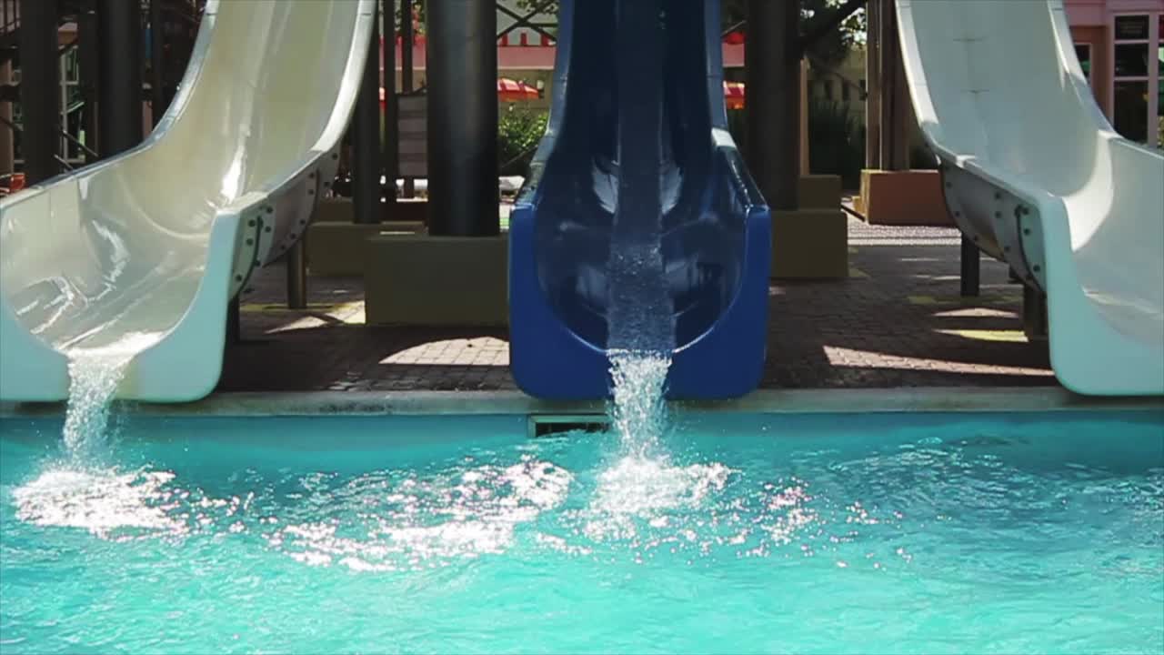 People Having Fun on Water Slides