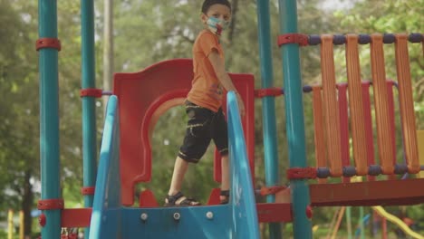 child playing in colorful playground. slow motion shot