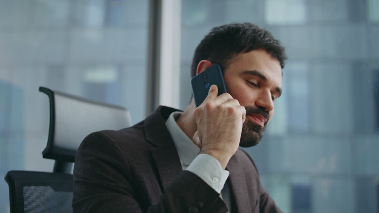 Banker discussing deal phone conversation in office close up. Manager calling