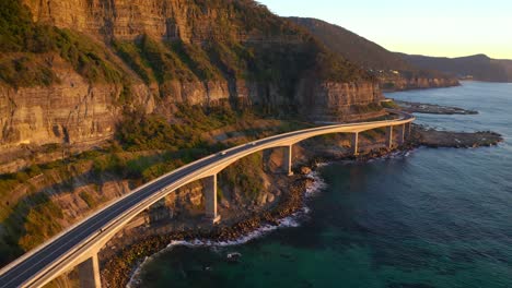 drive through scenic road with coastal scenery - sea cliff bridge in new south wales, australia